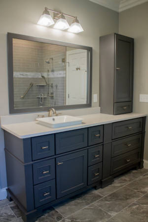 Franklin Tennessee bathroom Remodel grey vanity, white quartz countertop, decorative mirrors, grey tile