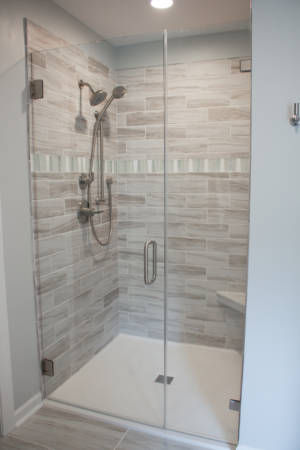 Franklin Tennessee Shower Remodel Grey Tile, white pan, brushed nickel hardware Niche Bench