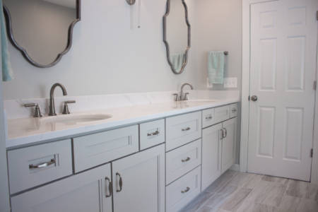 Franklin Tennessee bathroom Remodel grey double vanity, white quartz countertop, decorative mirrors, grey tile