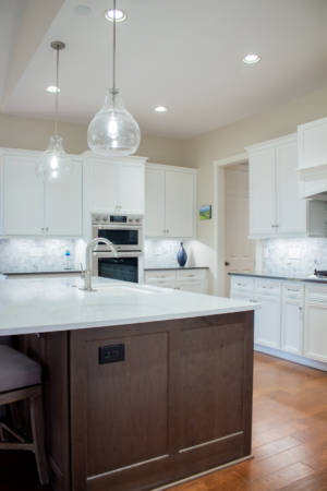 Franklin Tennessee Kitchen Remodel white cabinets, marble tile backsplash, quartz grey countertops, wood floors