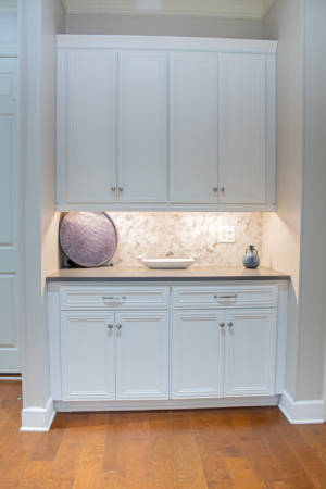 Franklin Tennessee Kitchen Remodel white cabinets, marble tile backsplash, quartz grey countertops, wood floors